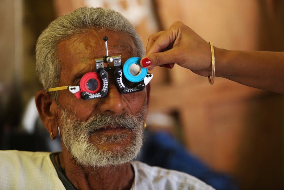 Patient recovering after cataract surgery with protective eye shield during post-operative check